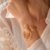 WhatsApp Image 2026-06-13 at 15.14.44 Elegant Filigree Fan Openwork Gold-Plated Hinged Cuff Bracelet