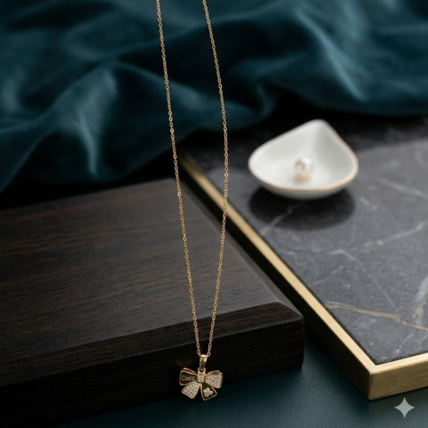 Untitled design - 2026-06-18T160141.436 Gold Plated Crystal Bow Pendant Necklace for Women | Elegant Bow Charm Necklace | Minimalist Fashion Jewelry